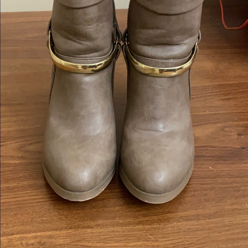 Light brown heeled Shoedazzle booties .